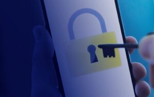 A lock image on the screen of a phone and a key reaching it